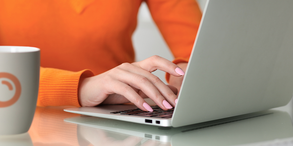a woman uses semrush on her computer